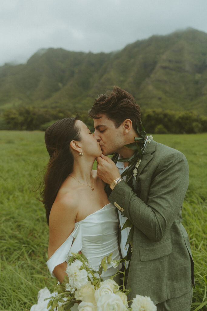 Couple standing together during their Makapuu Beach ceremony
