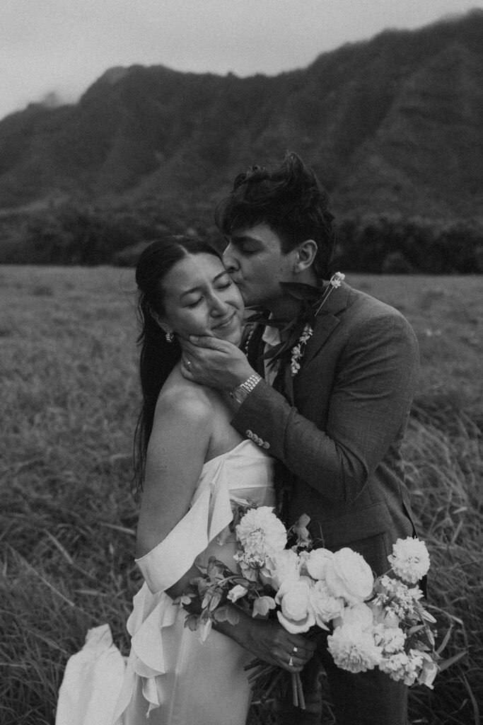 Couple standing together during their Makapuu Beach ceremony
