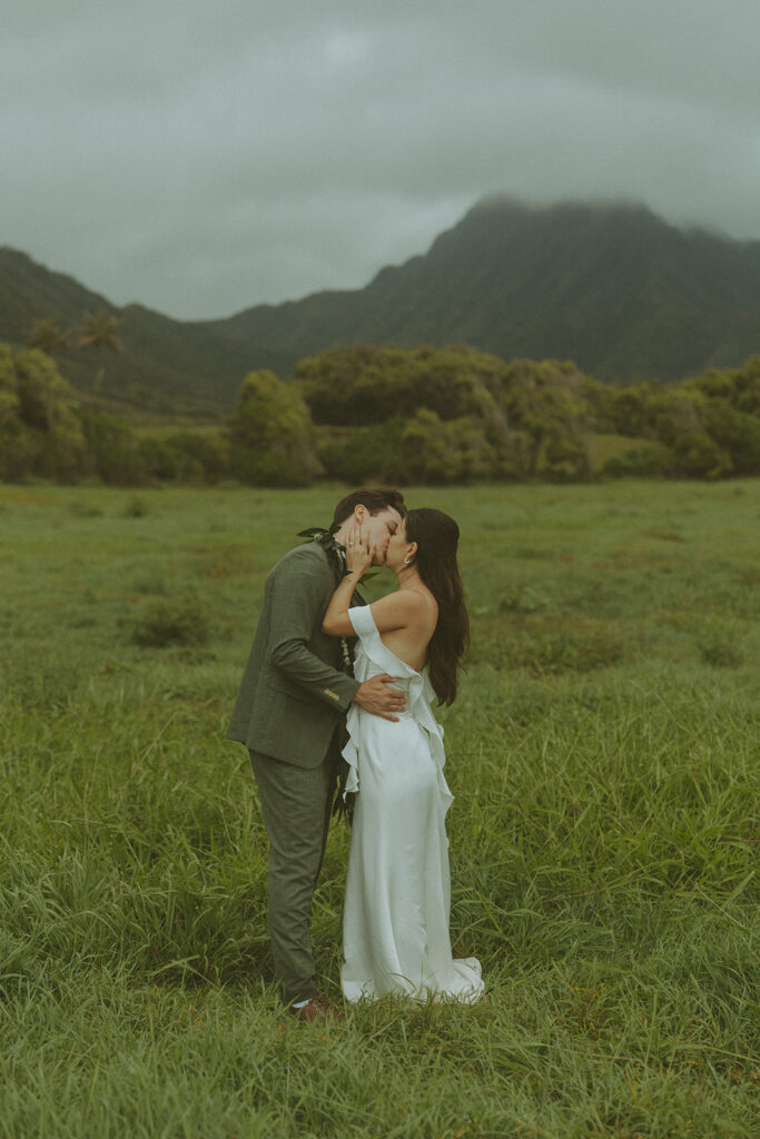Couple standing together during their Makapuu Beach ceremony
