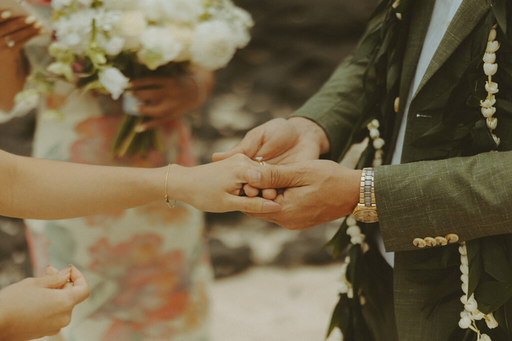 Couple standing together during their Makapuu Beach ceremony
