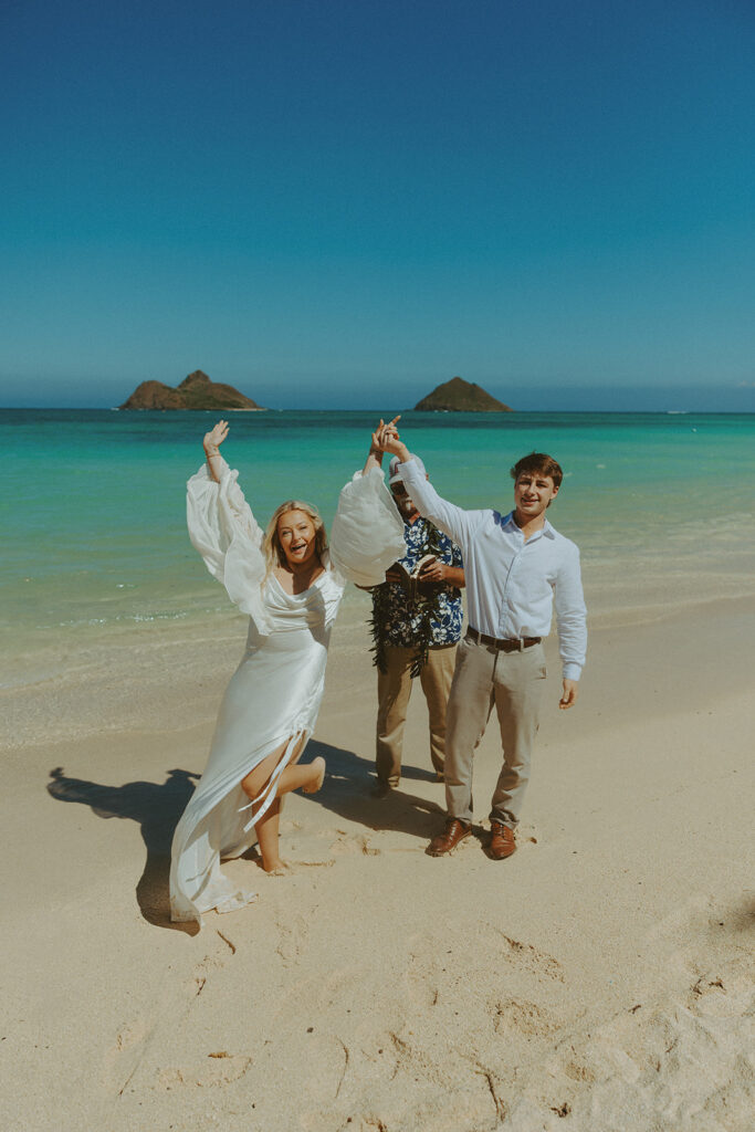 Couple standing on Lanikai Beach during their intimate elopement ceremony.
