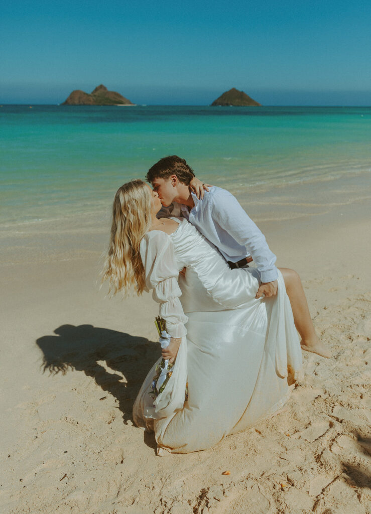 Couple standing on Lanikai Beach during their intimate elopement ceremony.