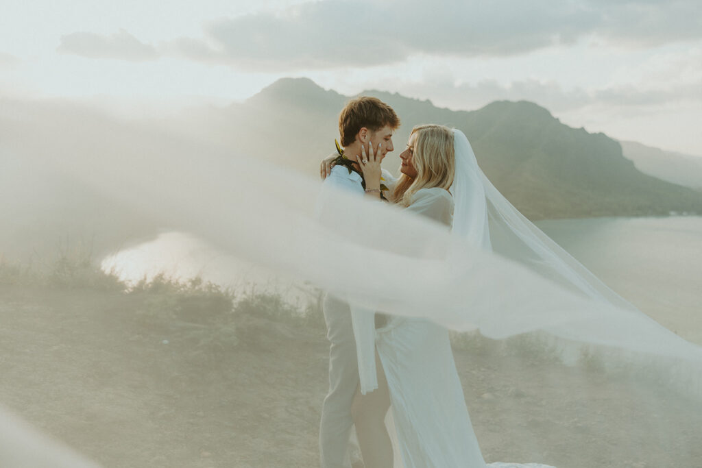 vElopement portraits overlooking the coastline from the top of Crouching Lion.

