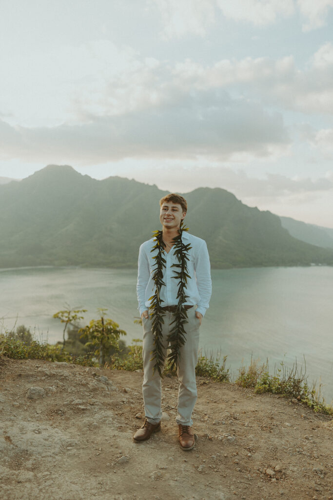 Elopement portraits overlooking the coastline from the top of Crouching Lion.