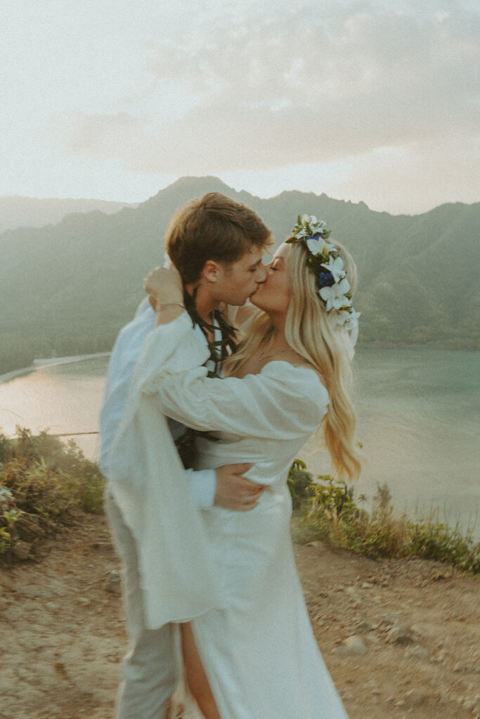 Elopement portraits overlooking the coastline from the top of Crouching Lion.
