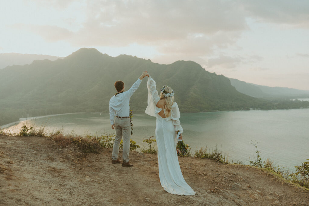 Elopement portraits overlooking the coastline from the top of Crouching Lion.
