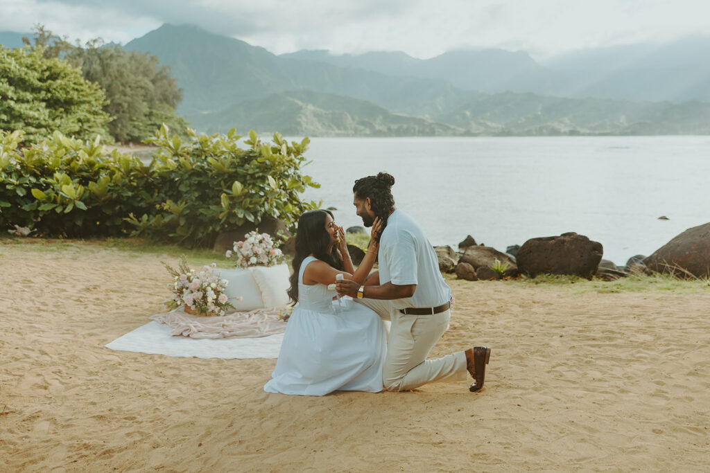 Newly engaged couple celebrating their proposal at 1 Hotel Hanalei Bay surrounded by tropical scenery