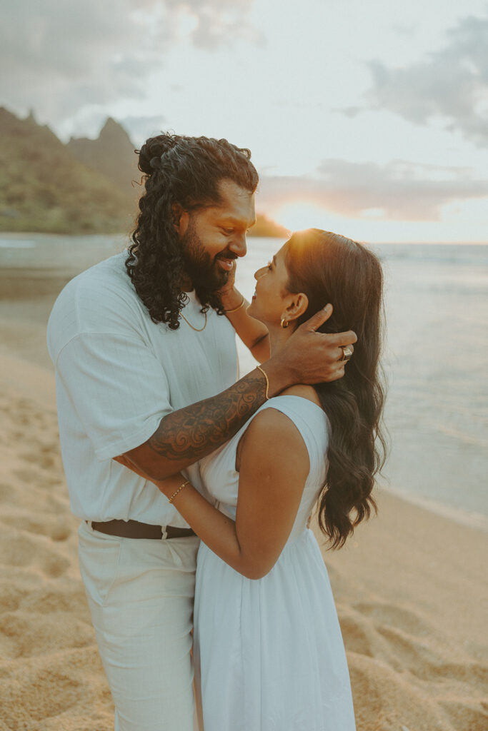 Newly engaged couple celebrating their proposal at 1 Hotel Hanalei Bay surrounded by tropical scenery