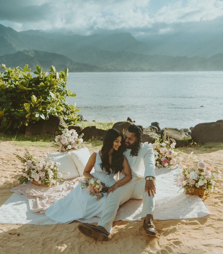 Newly engaged couple celebrating their proposal at 1 Hotel Hanalei Bay surrounded by tropical scenery