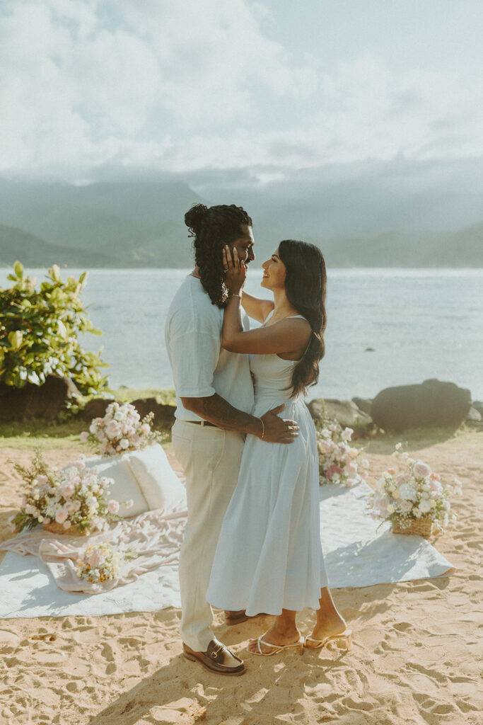 Couple walking along the shoreline at 1 Hotel Hanalei Bay on Kauai with ocean views and soft natural light