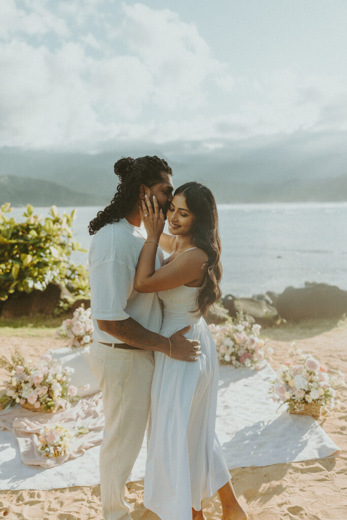 Newly engaged couple celebrating their proposal at 1 Hotel Hanalei Bay surrounded by tropical scenery