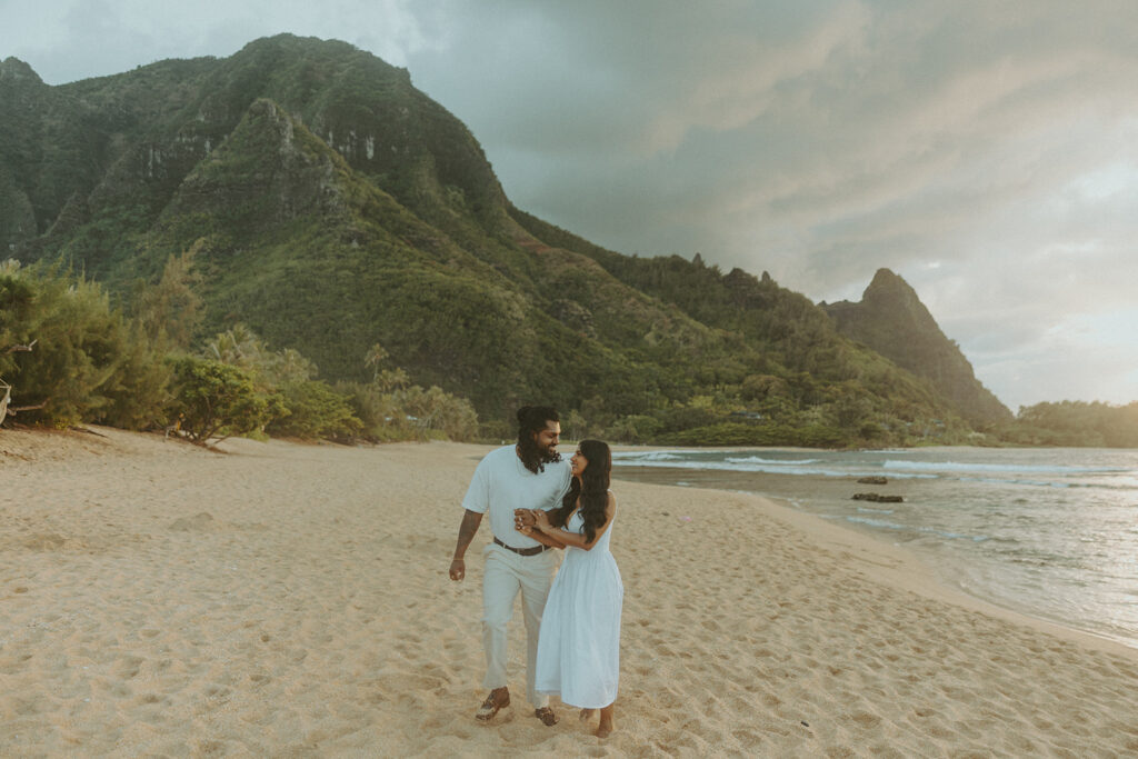 Romantic proposal setup with picnic details and flowers near the water at 1 Hotel Hanalei Bay
