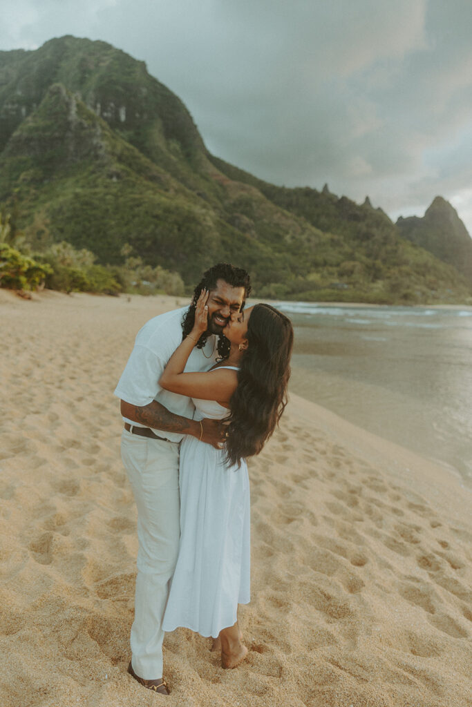 Couple walking along the shoreline at 1 Hotel Hanalei Bay on Kauai with ocean views and soft natural light