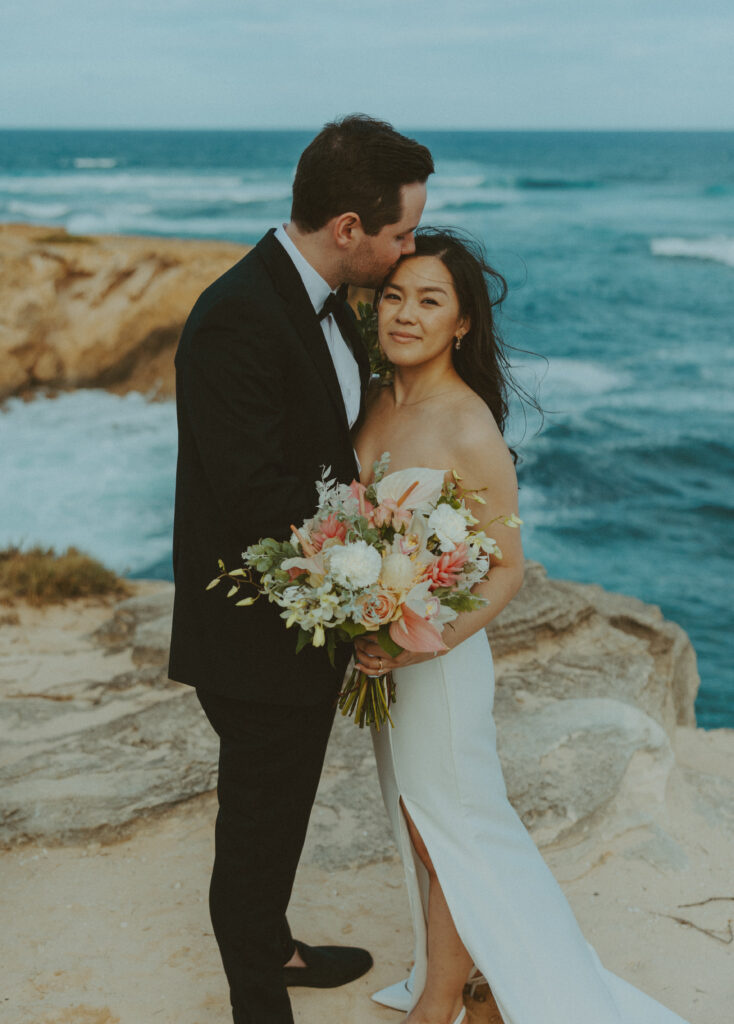 Romantic wedding portraits of a couple on the cliffs 
