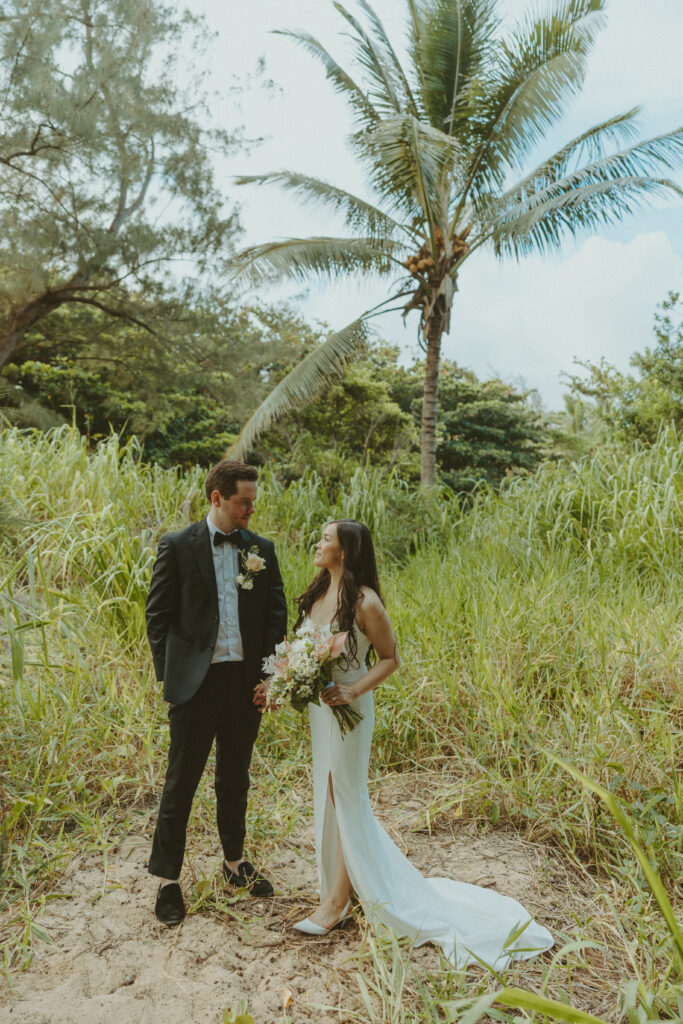 Couple exchanging vows on the cliffs during an intimate Hawaii elopement
