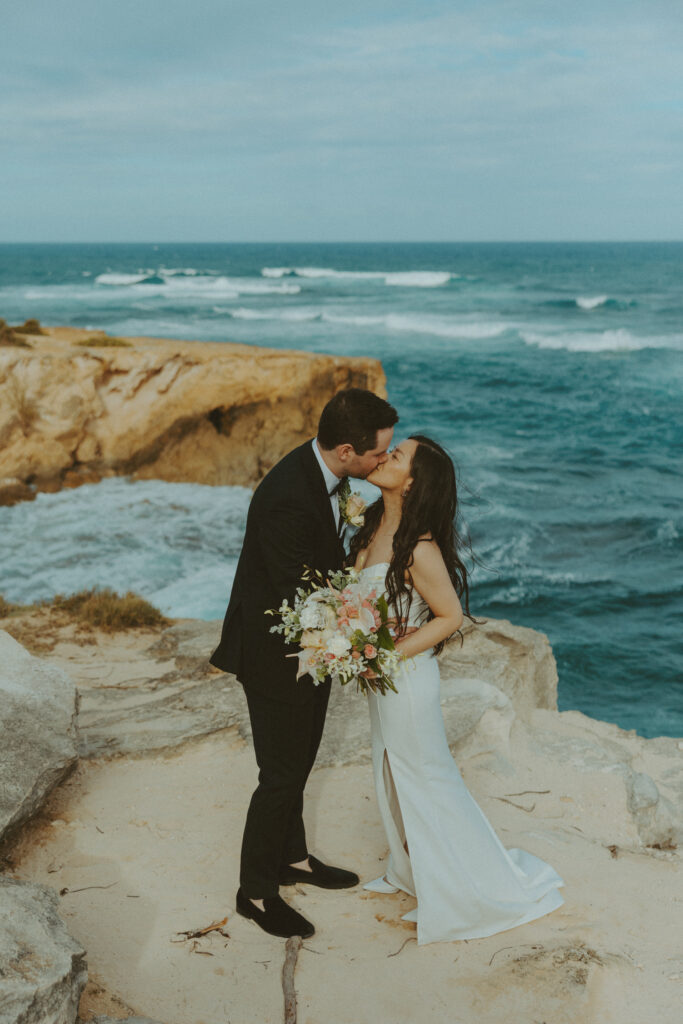 Romantic wedding portraits of a couple on the cliffs 

