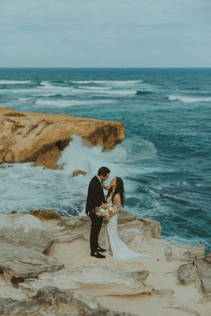 Romantic wedding portraits of a couple on the cliffs 
