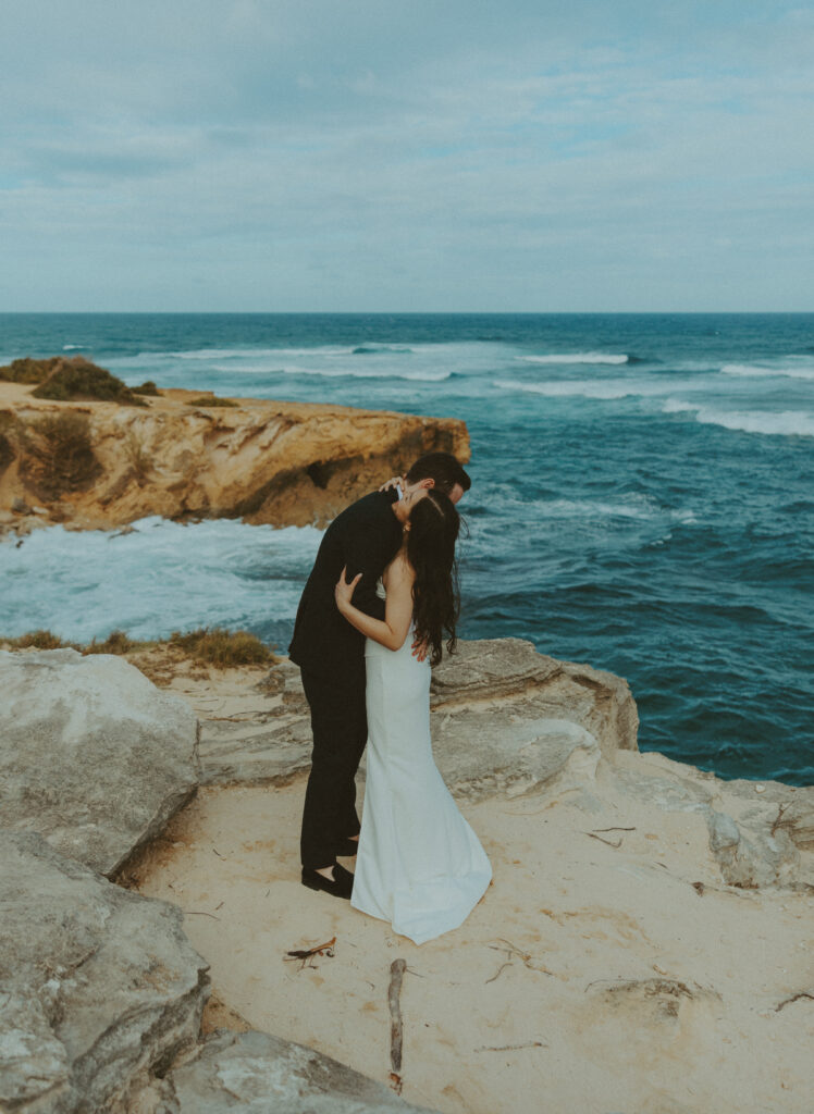 Romantic wedding portraits of a couple on the cliffs 
