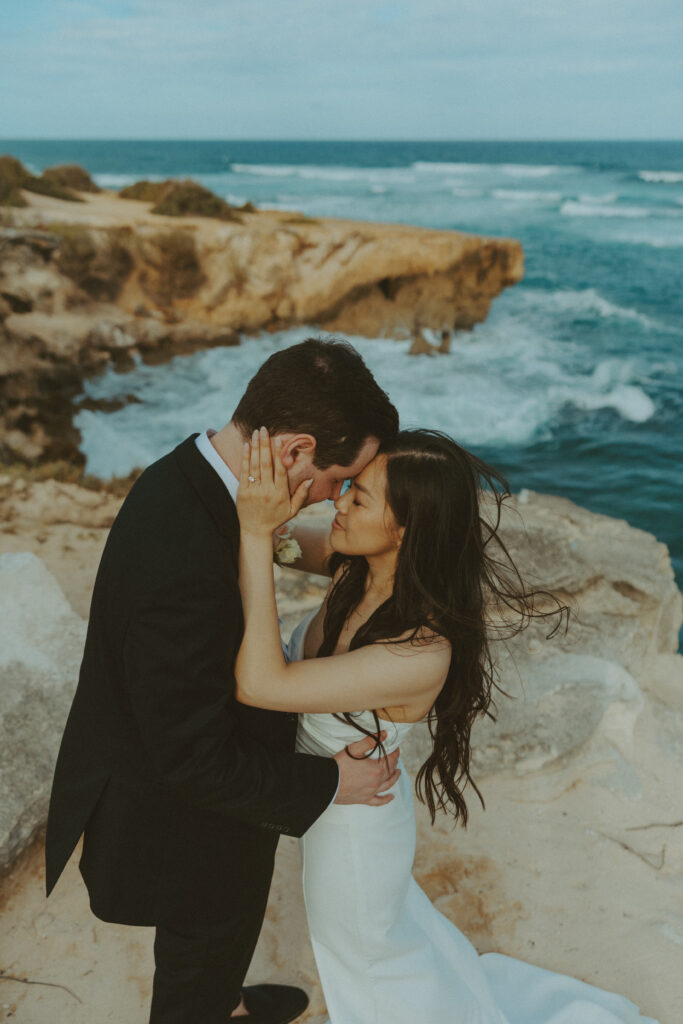 Romantic wedding portraits of a couple on the cliffs