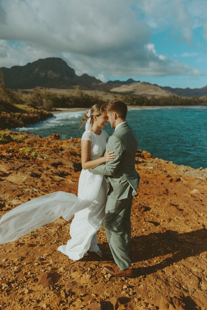 Sunrise couple portraits on the north shore of Kauai during a full weekend wedding experience
