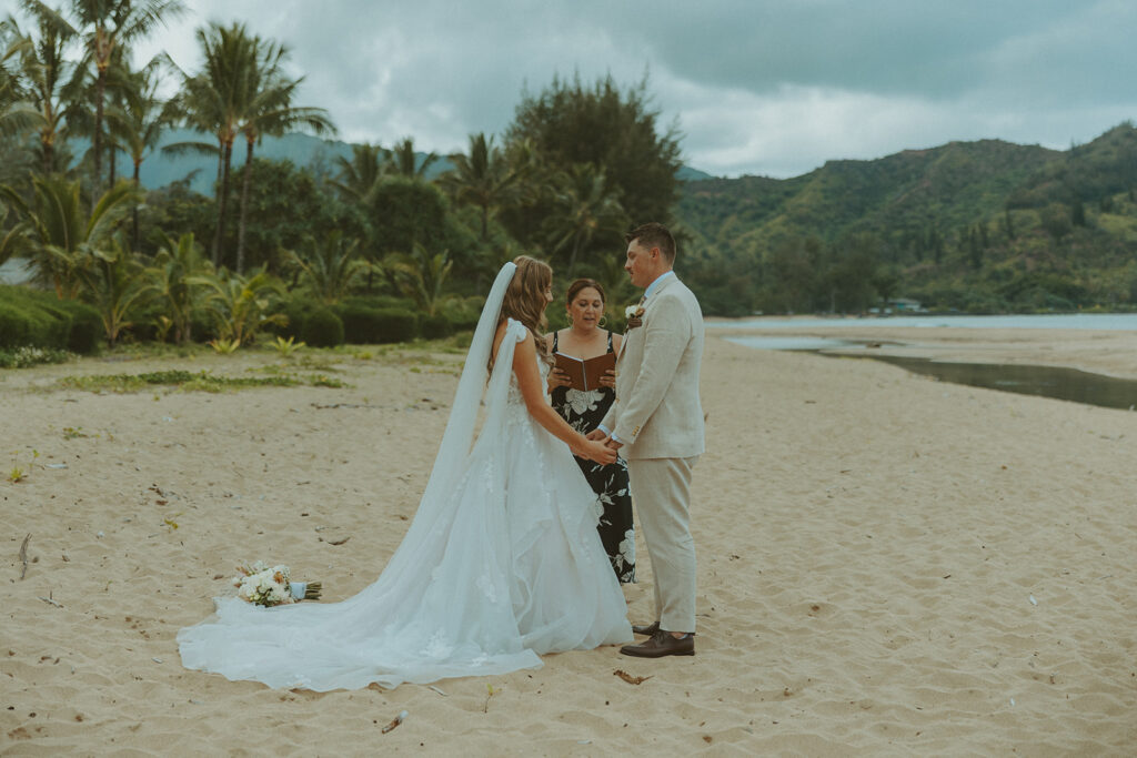 Small group of guests gathered for an outdoor wedding ceremony in Princeville.