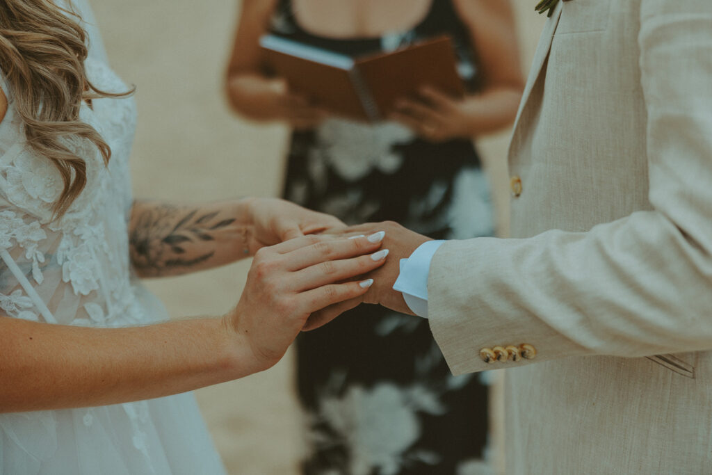 Small group of guests gathered for an outdoor wedding ceremony in Princeville.