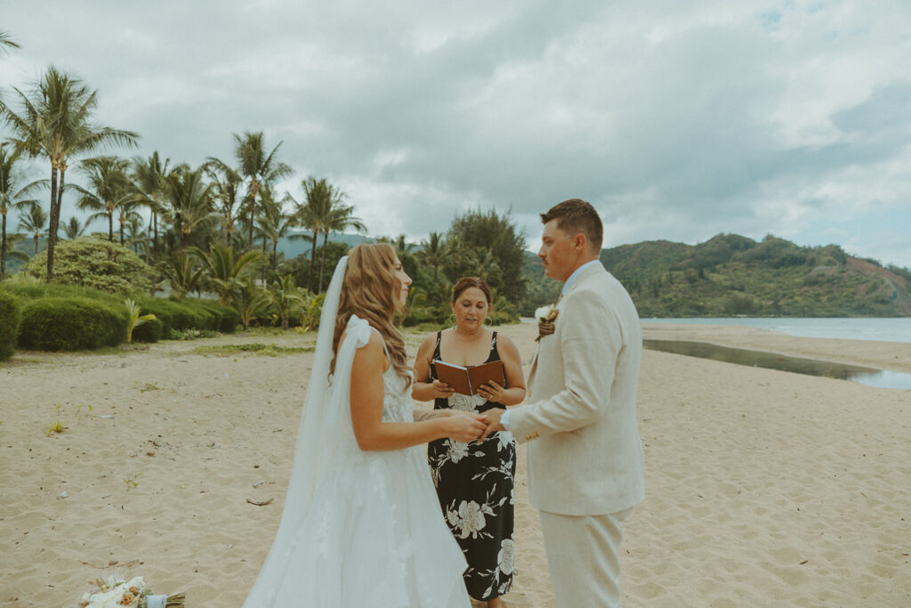 Small group of guests gathered for an outdoor wedding ceremony in Princeville.