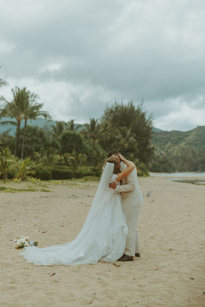 Small group of guests gathered for an outdoor wedding ceremony in Princeville.