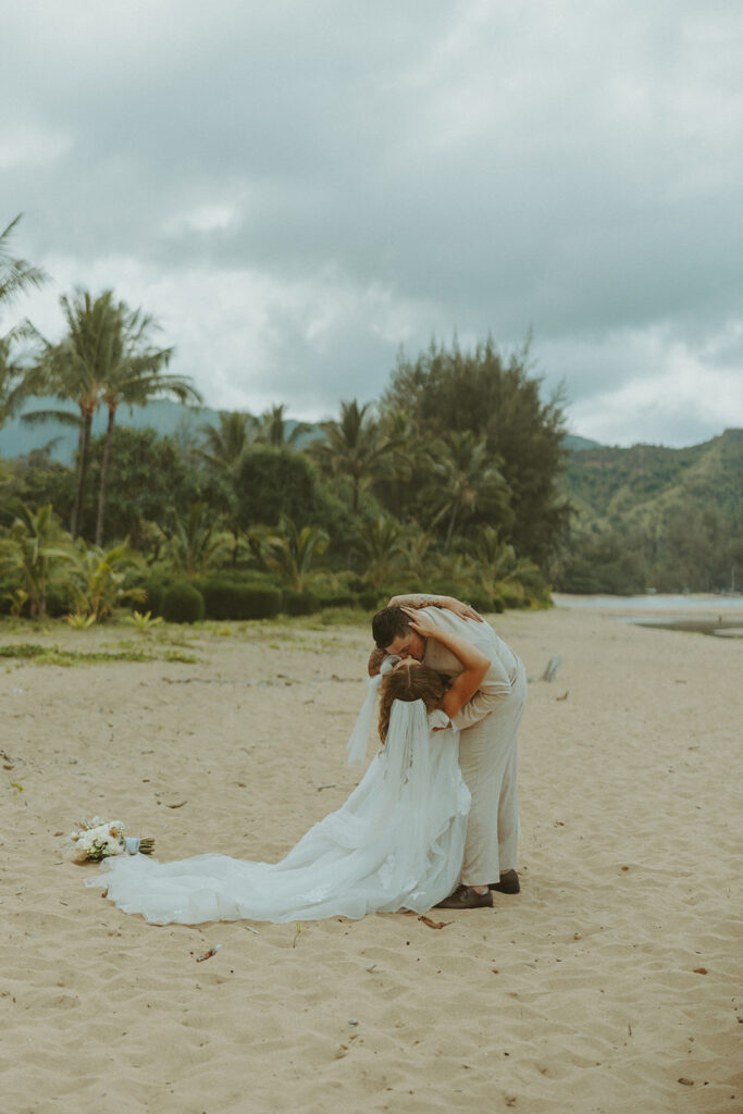 Small group of guests gathered for an outdoor wedding ceremony in Princeville.