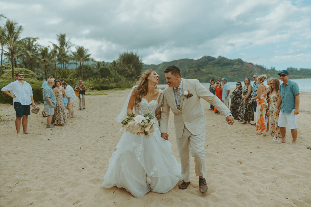 Small group of guests gathered for an outdoor wedding ceremony in Princeville.
