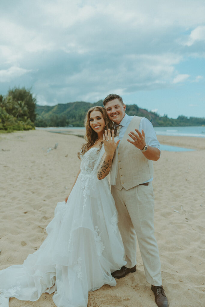 Couple sharing a quiet moment together with ocean and mountain views in Hanalei.
