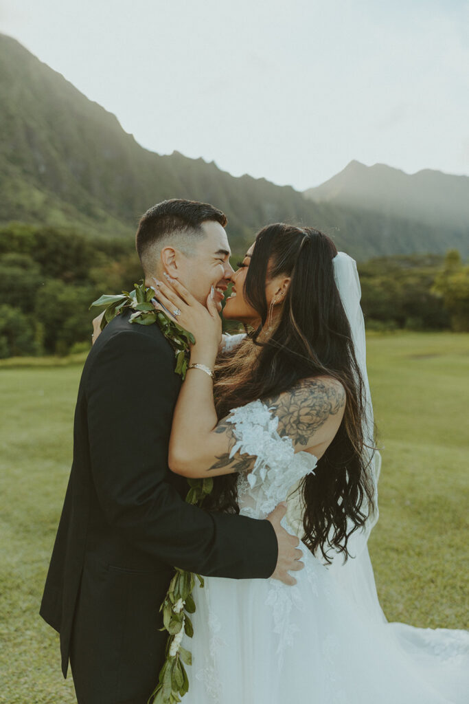 Wedding couple embracing in a lush natural setting
