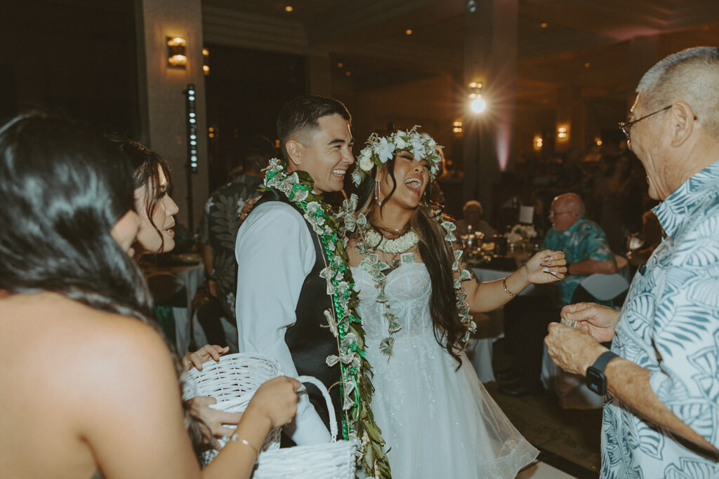 Bride and groom enjoying their reception with family and friends